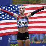 File- This Nov. 5, 2017, file photo shows Shalane Flanagan of the United States posing for pictures after crossing the finish line first in the women's division of the New York City Marathon in New York. Flanagan will run in Boston next year in a fourth attempt to win her hometown race. The four-time Olympian and reigning Chicago Marathon champion will be joined on the men?s side by Galen Rupp in a field of elite Americans announced Monday, Dec. 11, 2017, by race sponsor John Hancock. Olympians Desiree Linden, Dathan Ritzenhein, Abdi Abdirahman, Deena Kastor and Molly Huddle also are signed up for the 122nd edition of the world?s oldest annual marathon, which is being held April 16.(AP Photo/Seth Wenig, File)