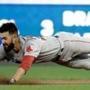 Red Sox starting pitcher Rick Porcello dives into second base with a double in the third inning Tuesday. 