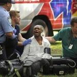 An ambulance crew responds to one of three simultaneous drug overdose victims on the New Haven Green, a city park in New Haven, Conn., Thursday, Aug. 16, 2018. Investigators try to determine exactly what sickened them and tens of other victims. People started falling ill Wednesday morning, mostly on the New Haven Green. No deaths were reported. Police have arrested a man who they say may have passed out free samples of synthetic marijuana. (Brian A. Pounds/Hearst Connecticut Media via AP)