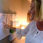 Scituate 07/09/2018: Lisa Blake, a professional organizer, looks at the schedule in the Command Central space of her Scituate home. The space was created to organize and post her three boys schedules for upcoming events. Photo by Debee Tlumacki for the Boston Globe (regional)