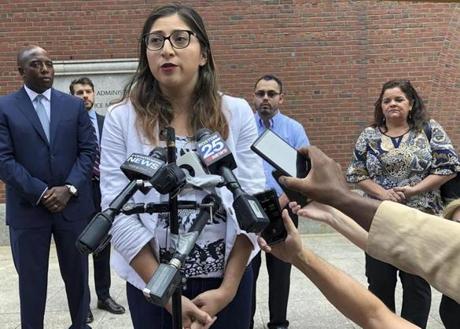 Lilian Calderon, one of the people suing the Trump administration and the Department of Homeland Security over the arrests of immigrants who showed up for hearings at government offices, answered questions during a lunch break outside federal court on Monday.
