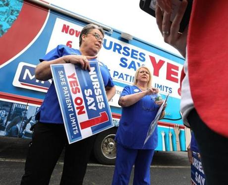 Karen Coughlin (left) and Donna Kelly-Williams, president of the Massachusetts Nurses Association, during Tuesday?s rally at the Somerville headquarters of Partners HealthCare. 
