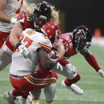 Falcons safety Keanu Neal (right) and defensive end Brooks Reed hit Chiefs running back Kareem Hunt during a preseason. Neal was called for a penalty on the hit. 