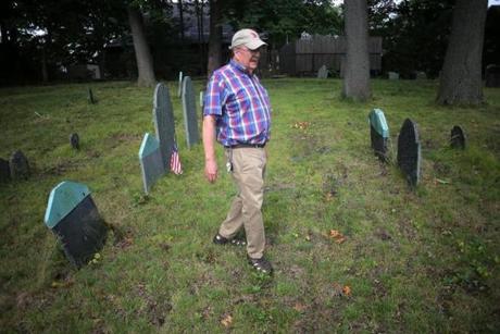 Stoneham, MA - 07/26/18 - Ben Jacques (cq) walks among the graves. The Old Burying Ground in Stoneham holds unmarked graves of slaves of prominent Stoneham families. (Lane Turner/Globe Staff) Reporter: (osen) Topic: (29zoslavery)
