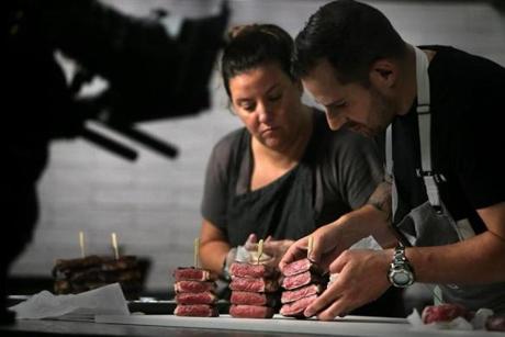 ButcherBox head chef Yankel Polak styled a scene with test kitchen manager Emilie Abijanac during a video shoot in Peabody. In addition to getting meat delivered, subscribers to the service gain access to videos that detail the preparation of various dishes.
