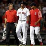 Boston, MA - 7/28/2018 - (8th inning) Boston Red Sox third baseman Rafael Devers (11) is assisted off he field after injuring himself while sliding into third base during the eighth inning. The Boston Red Sox host the Minnesota Twins in the third of a four game series at Fenway Park. - (Barry Chin/Globe Staff), Section: Sports, Reporter: Peter Abraham, Topic: 29Red Sox-Twins, LOID: 8.4.2639724244.
