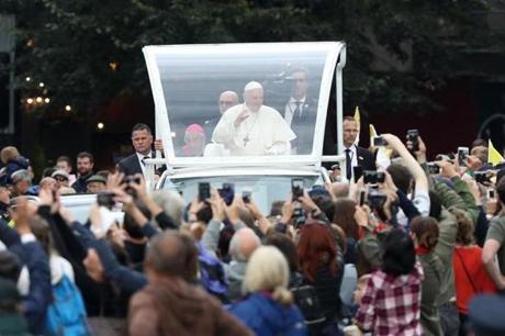 DUBLIN, IRELAND - AUGUST 25: Pope Francis greets the public as he travels through the city in the Popemobile on August 25, 2018 in Dublin, Ireland. Pope Francis is the 266th Catholic Pope and current sovereign of the Vatican. His visit, the first by a Pope since John Paul II's in 1979, is expected to attract hundreds of thousands of Catholics to a series of events in Dublin and Knock. During his visit he will have private meetings with victims of sexual abuse by Catholic clergy. (Photo by Matt Cardy/Getty Images)
