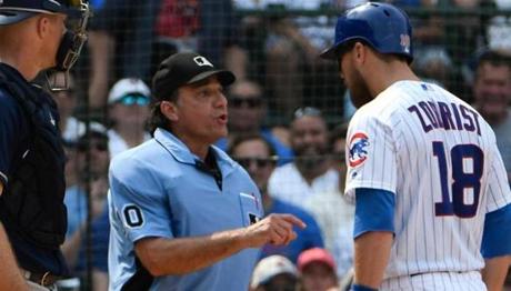 Chicago Cubs' Ben Zobrist (18) argues a strike call with umpire Phil Cuzzi (10) during the sixth inning of a baseball game, Tuesday, Aug. 14, 2018, in Chicago. (AP Photo/David Banks)
