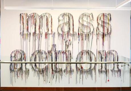  ?Mass Action,? made up of shoe strings, was created by artist Nari Ward.
