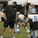 Detroit Lions head coach Matt Patricia gestures while talking with defensive end Ezekiel Ansah (94) during NFL football practice, Tuesday, Aug. 7, 2018, in Napa, Calif. The Oakland Raiders and the Detroit Lions held a joint practice before their upcoming preseason game on Friday. (AP Photo/Eric Risberg)