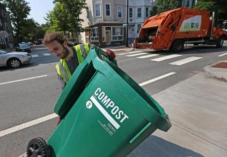 Jacob Rezendes, a trash collector in Cambridge, moved a compost bin. 
