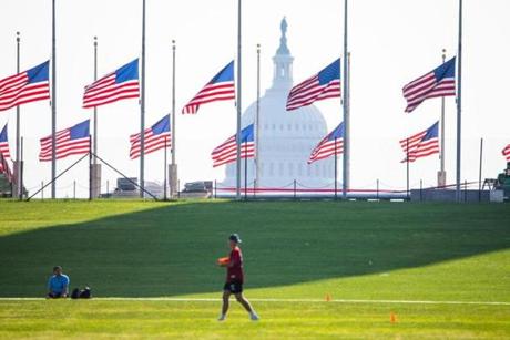 Mandatory Credit: Photo by JIM LO SCALZO/EPA-EFE/REX/Shutterstock (9808446d) US flags fly at half-staff around the Washington Monument in Washington, DC, USA, 26 August 2018. Flags were flown at half-staff honoring Republican Senator John McCain who passed away at his home in Cornville, Arizona, USA, on 25 August 2018, at the age of 81. His family announced on 24 August 2018, that he discontinued treatment for an aggressive brain cancer. McCain, a former Naval aviator, was shot down on a mission over Hanoi, in North Vietnam, in October 1967, and made a prisoner of war (POW) until 1973. He was the Republican nominee for President of the United States in the 2008 election, which he lost to Barack Obama. Flags at Half-Staff Over the White House for McCain, Washington, USA - 26 Aug 2018
