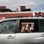 A pair of feet hang out a car window on Beacon Street in Cleveland Corner on Tuesday.