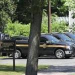 Vehicles for the Massachusetts Environmental Police parked at the office on Milk Street in Westborough.