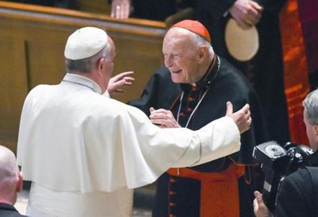 FILE - In this Sept. 23, 2015 file photo, Pope Francis reaches out to hug Cardinal Archbishop emeritus Theodore McCarrick after the Midday Prayer of the Divine with more than 300 U.S. Bishops at the Cathedral of St. Matthew the Apostle in Washington. Seton Hall University has begun an investigation into potential sexual abuse at two seminaries it hosts following misconduct allegations against ex-Cardinal McCarrick and other priests. (Jonathan Newton/The Washington Post via AP, Pool, File)
