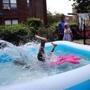 Charlestown, MA - August 28, 2018: Josiah Saint Cyr plunges into a pool while playing with friends at the Boston Housing Authority's Charlestown Development in Charlestown, MA on August 28, 2018. Forecasters say it?s going to feel hotter than 100 degrees outside, and this hazy, hot, and humid weather is expected to stick around until Wednesday night. The National Weather Service issued an excessive heat warning that will remain in effect from 10 a.m. Tuesday until 9 p.m. Wednesday, because heat index values could reach as high as 105 degrees in some places. (Craig F. Walker/Globe Staff) section: Metro reporter: