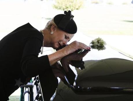 Cindy McCain laid her head on the casket of her husband, Senator John McCain,  during a burial service at the US Naval Academy on Sunday.
