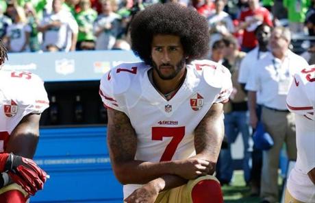  FILE - In this Sept. 25, 2016, file photo, San Francisco 49ers? Colin Kaepernick kneels during the national anthem before an NFL football game against the Seattle Seahawks, in Seattle. Kaepernick has a new deal with Nike, even though the NFL does not want him.
