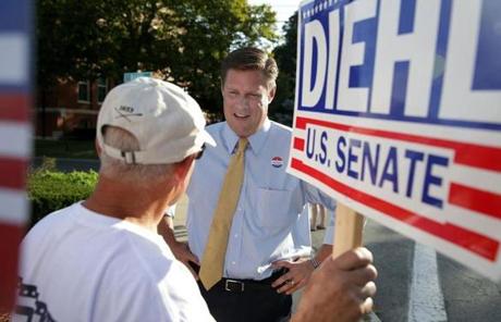 Geoff Diehl (center) with a supporter, after voting at Whitman Town Hall. Diehl is running for the US Senate. 
