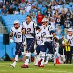 New England Patriots quarterback Tom Brady (12) leading the team onto the field against the Carolina Panthers during an NFL game in Charlotte, N.C. on Friday, Aug. 24, 2018. (Chris Keane/AP Images for Panini)