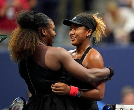 Serena Williams (left) and Naomi Osaka embraced Saturday after the US Open final.
