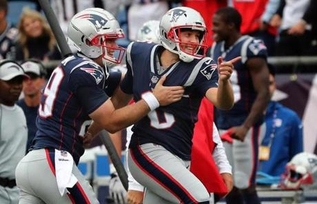 PATRIOT SLIDER Foxborough MA 9/9/18 New England Patriots punter Ryan Allen (right) celebrates with teammate Joe Cardona after his punt was downed at the 1 yard line against the Houston Texans during fourth quarter action at Gillette Stadium. (photo by Matthew J. Lee/Globe staff) topic: reporter: 
