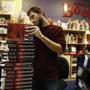 Matthew Reese, a bookseller at Porter Square Books, sorted through a stack of pre-orders for the Bob Woodward book ?Fear.?