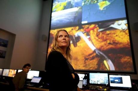 Julie Huber, an associate scientist in marine chemistry and geochemistry at Woods Hole Oceanographic Institution, inside the Inner Space Center Mission Control area at the University of Rhode Island in Narragansett. NASA is preparing for future space missions by exploring underwater volcanoes off Hawaii. 
