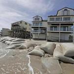 Sand bags surrounded homes on North Topsail Beach, N.C.