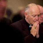 (FILES) In this file photo taken on November 11, 2002, Archbishop of Washington Cardinal Theodore McCarrick prays during a prayer for deceased bishops at the start of the morning session of the US Conference of Catholic Bishops being held in Washington, DC.