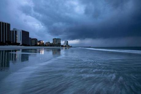 TOPSHOT - Rain begins to fall as the outer bands of Hurricane Florence make landfall in Myrtle Beach, South Carolina on September 13, 2018. - Hurricane Florence edged closer to the east coast of the Hurricane Florence edged closer to the east coast of the US Thursday, with tropical-force winds and rain already lashing barrier islands just off the North Carolina mainland. The huge storm weakened to a Category 2 hurricane overnight, but forecasters warned that it still packed a dangerous punch, 110 mile-an-hour (175 kph) winds and torrential rains. (Photo by Alex Edelman / AFP)ALEX EDELMAN/AFP/Getty Images
