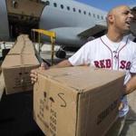 San juan- Jan. 30, 2018- Stan Grossfeld/Globe Staff- Red Sox manager Alex Cora unloads some of the 10 tons of relief supplies to his native Puerto Rico 