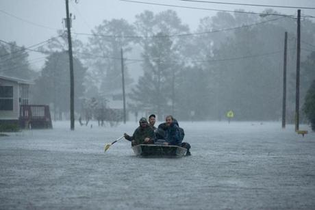 NEW BERN, NC - SEPTEMBER 14: Volunteers from all over North Carolina help rescue residents from their flooded homes during Hurricane Florence September 14, 2018 in New Bern, North Carolina. Hurricane Florence made landfall in North Carolina as a Category 1 storm and flooding from the heavy rain is forcing hundreds of people to call for emergency rescues in the area around New Bern, North Carolina, which sits at the confluence of the Nuese and Trent rivers. The storm has since been downgraded to a tropical storm. (Photo by Chip Somodevilla/Getty Images)
