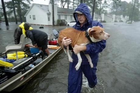 Volunteers helped rescue residents and their pets from their flooded homes in New Bern, North Carolina during Hurricane Florence on Friday.
