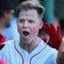 Boston, MA: 9-16-18: The Red Sox Brock Holt celebratesz in the dugout with teammates following his bottom of the third inning two run home run that gave Boston a 3-0 lead. The Red Sox hosted the New York Mets in an inter league regular season MLB baseball game at Fenway Park. (Jim Davis/Globe Staff) 