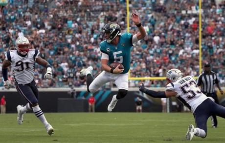 Jacksonville, FL - 9/16/2018 - (3rd quarter) Jacksonville Jaguars quarterback Blake Bortles (5) called his own number and scrambled for a first down on this run during the third quarter. The Jacksonville Jaguars host the New England Patriots at TIAA Bank Field in Jacksonville, FL. - (Barry Chin/Globe Staff), Section: Sports, Reporter: Ben Volin, Topic: 17Patriots-Jaguars, LOID:8.4.3163038406.
