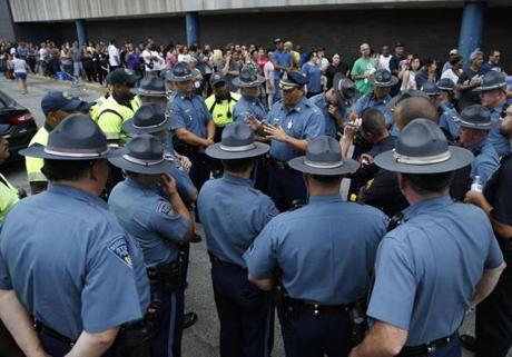 State Troopers gathered to discuss a crowd control plan Sunday after finding out that the Columbia Gas of Massachusetts customer help center was at capacity as many South Lawrence residents waited to file a claim. 
