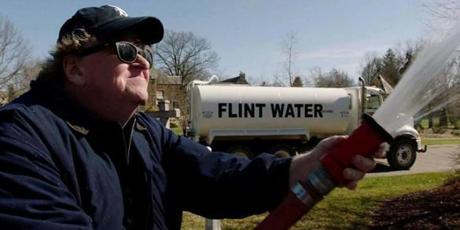 Michael Moore sprays water from Flint, Mich., on the governor?s lawn in ?Fahrenheit 11/9.?
