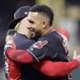 Cleveland Indians' Michael Brantley, right, hugs a teammate after hitting a winning RBI-single in the 11th inning of a baseball game against the Boston Red Sox, Saturday, Sept. 22, 2018, in Cleveland. (AP Photo/Tony Dejak)