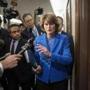 Arriving to chair the Senate Energy and Natural Resources Committee, Sen. Lisa Murkowski, R-Alaska, is pursued by reporters asking about her stand on President Donald Trump's embattled Supreme Court nominee, Brett Kavanaugh, on Capitol Hill in Washington, Tuesday, Sept. 25, 2018. (AP Photo/J. Scott Applewhite)