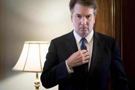 FILE -- Judge Brett Kavanaugh, President Donald Trump's nominee for the Supreme Court, adjusts his tie while he waits to meet with Sen. Richard Shelby (R-Ala.) on Capitol Hill in Washington, July 30, 2018. Kavanaugh's pluses have become minuses as his time at elite schools has given rise to sexual misconduct claims and his long record in Washington has fueled Democratic distrust, Carl Hulse writes. (Erin Schaff/The New York Times)

