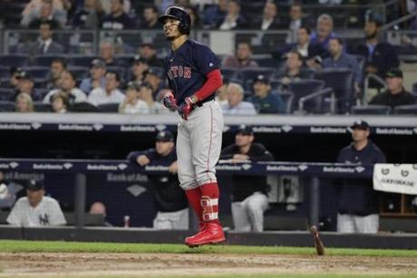 Boston Red Sox's Mookie Betts flips his bat after hitting a three-run home run during the eighth inning of a baseball game against the New York Yankees Thursday, Sept. 20, 2018, in New York. (AP Photo/Frank Franklin II)
