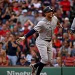Boston, MA - 9/29/2018 - (7th inning) New York Yankees designated hitter Giancarlo Stanton (27) celebrates his solo home run off Boston Red Sox starting pitcher Steven Wright (35) with New York Yankees Adeiny Hechavarria (29) during the seventh inning. The Boston Red Sox host the New York Yankees in Game 2 of a three game series at Fenway Park. - (Barry Chin/Globe Staff), Section: Sports, Reporter: Peter Abraham, Topic: 30Red Sox-Yankees, LOID: 8.4.3290523935.