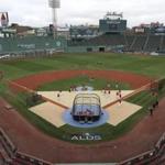 Boston Red Sox players practice during a baseball workout at Fenway Park Wednesday. The Red Sox will face the Yankees in the American League division series on Friday.