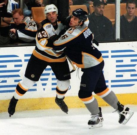 Joe Murphy (left) collided with Nashville's Bob Boughner during a December 1999 game. The Bruins waived Murphy two months later, and he played just 48 more NHL games.
