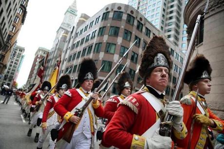 Reenactors Rob Lee (front, left) and Jeffery Meriwether (right) marched toward the Old State House. 
