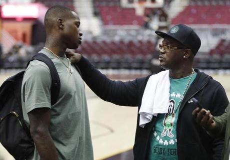 Terry Rozier Sr. (right) and his son, Terry, meet following a preseason game Saturday. 
