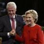 Democratic U.S. presidential nominee Hillary Clinton holds hands with her husband, former President Bill Clinton, as they leave the stage after the conclusion of the first debate with Republican U.S. presidential nominee Donald Trump at Hofstra University in Hempstead, New York, U.S., September 26, 2016. REUTERS/Joe Raedle/Pool 