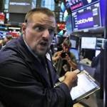 Trader Michael Milano worked on the floor of the New York Stock Exchange on a wild Wednesday. 