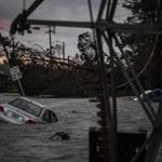 A car is seen caught in flood water in Panama City, Fla., after Hurricane Michael made landfall along the Florida panhandle on Oct. 10, 2018. MUST CREDIT: Washington Post photo by Jabin Botsford.